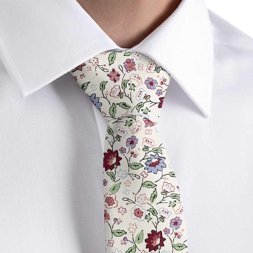 close up of a floral necktie on a person