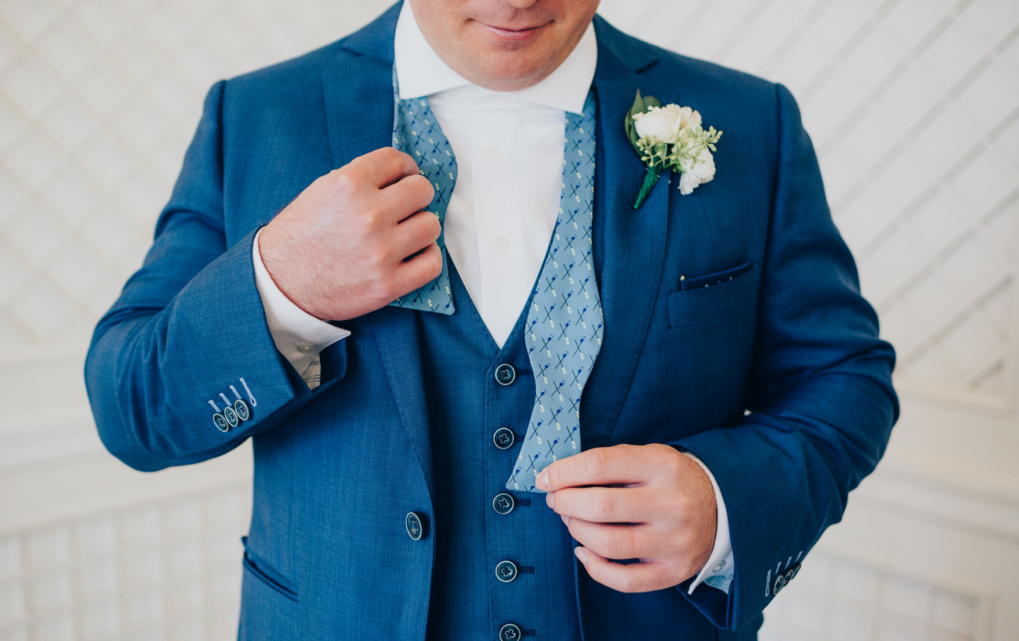 man tying a bow tie