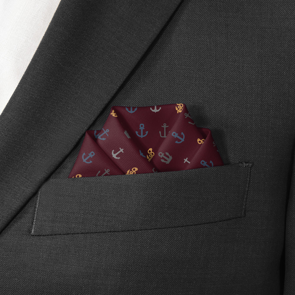 anchor themed pocket square folded in a suit jacket pocket