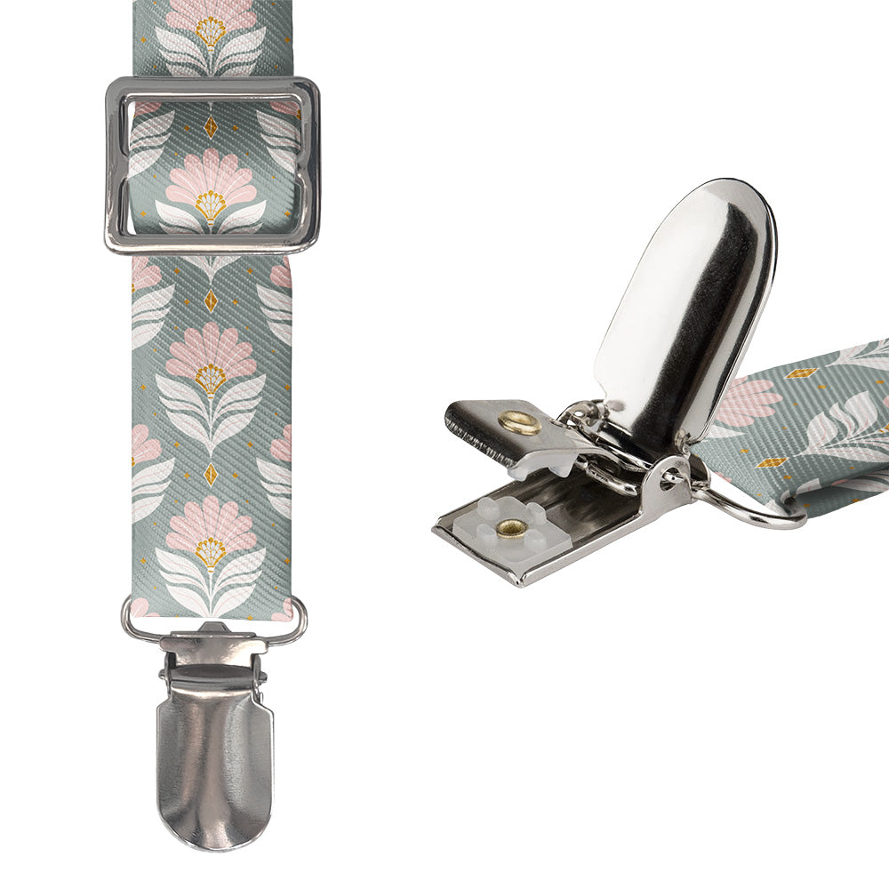 Floral patterned suspenders with metal clips on a white background