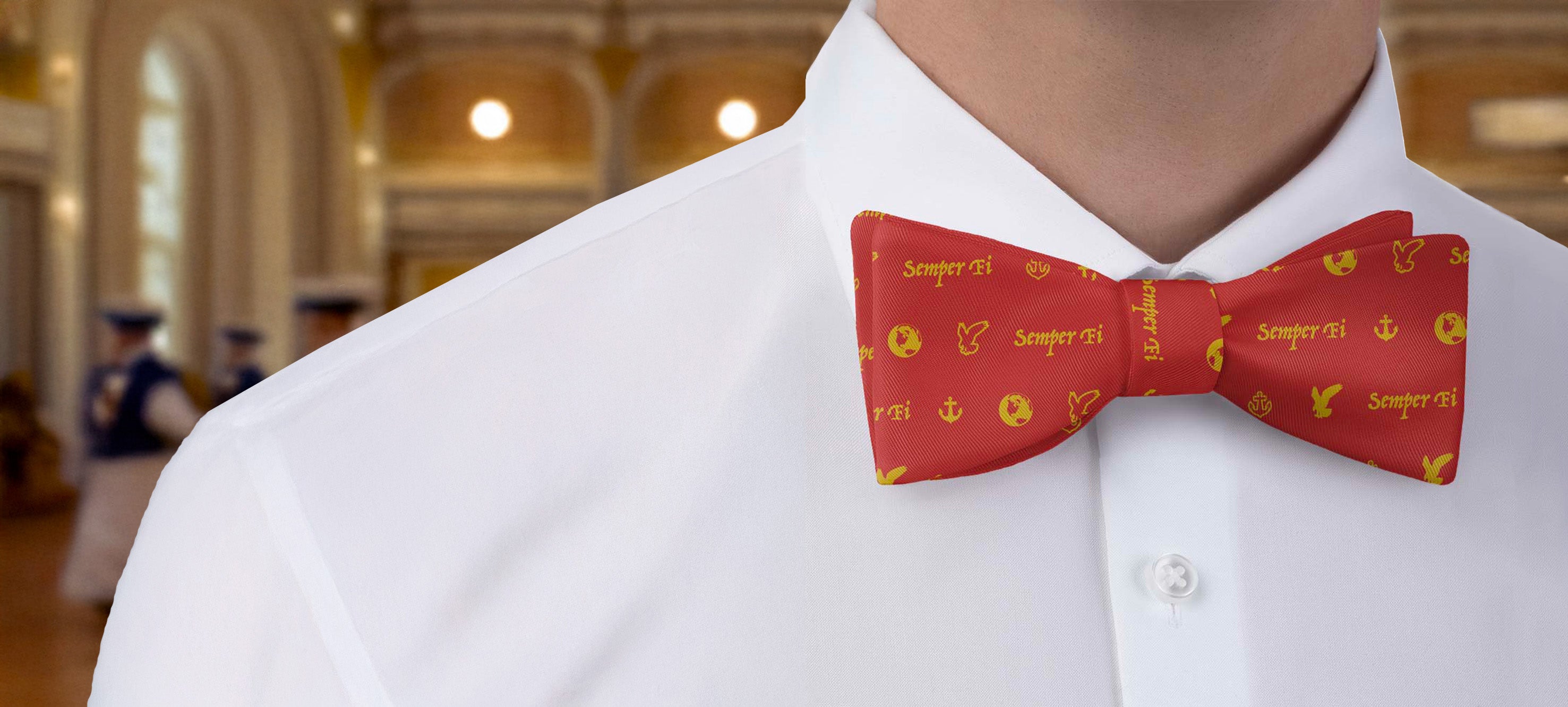 Red military bow tie on a white shirt in an indoor setting