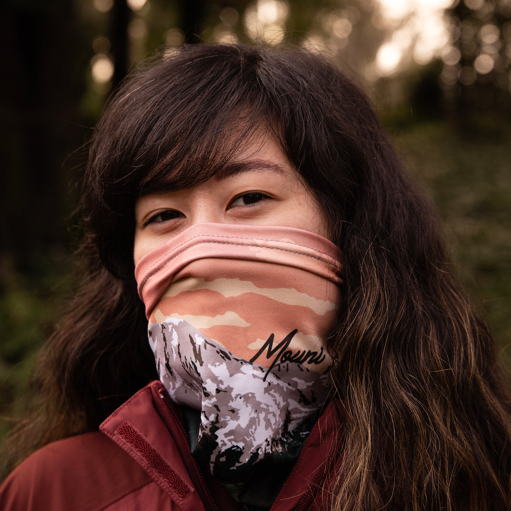 women wearing a neck gaiter in nature