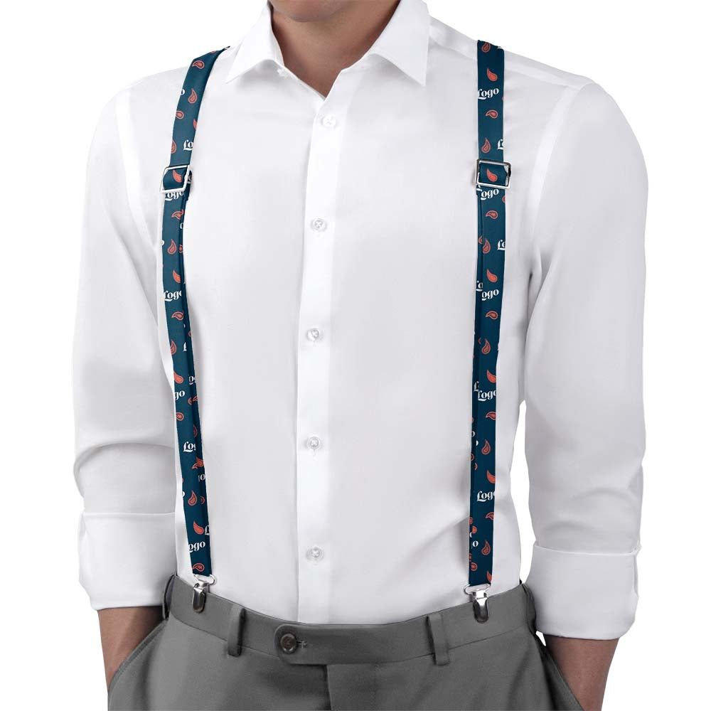 Person wearing a white shirt and gray pants with blue suspenders featuring a logo pattern.