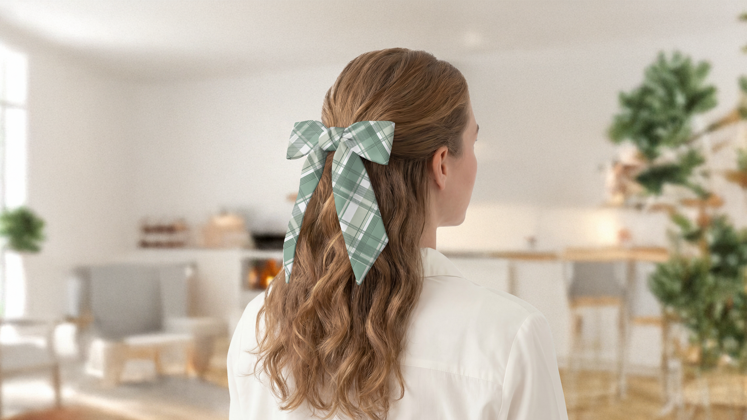 Person with a green plaid hair scarf in a room with plants and furniture