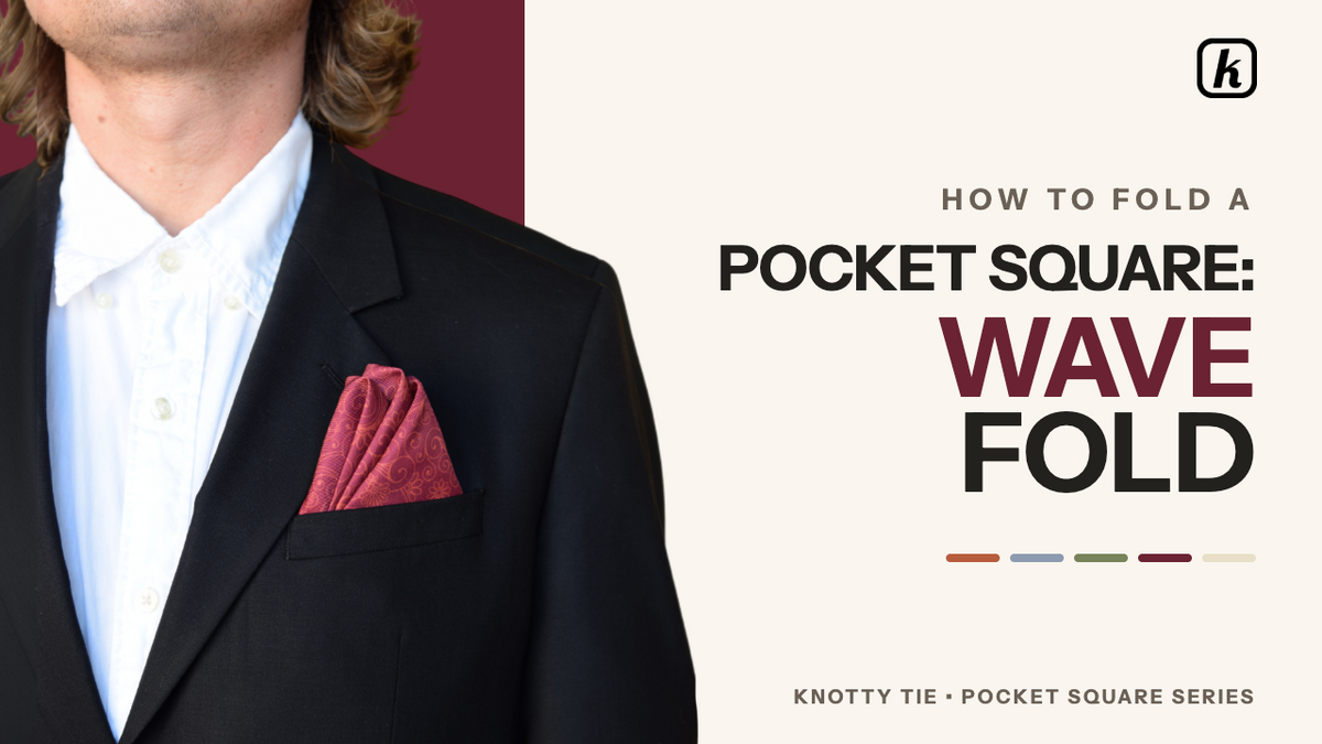 Load video: The Wavefold is a pocket square style that adds texture and volume, offering an elegant yet playful aesthetic.Usage and SuitabilityIt is well-suited for cocktail parties, weddings, or smart casual dinners.It is not recommended for strict black-tie events or instances where the goal is to highlight a single logo design.Folding InstructionsInitial Setup: Lay the pocket square flat with the printed side down in a diamond orientation, with one point facing you.Creating the Base: Fold the top point down to meet the bottom point to create a triangle, then smooth out any wrinkles.Forming Layers: Fold the right point over to meet the left point. Fold this in half again by bringing the bottom right point over to the top left point to reveal three layers, which form the waves.Creating the Folds: Fold the top right corner down to meet the bottom point, then fold the left corner in the opposite direction toward the back.Securing and Shaping: Pinch the bottom of the fabric to keep the folds in place, ensuring the front and back look identical. Gently separate the top layers to form three waves, embracing slight asymmetry for charm.Final Placement: Place the bottom point into the pocket first, allowing the waves to fan out above the edge, and adjust until it appears effortless.