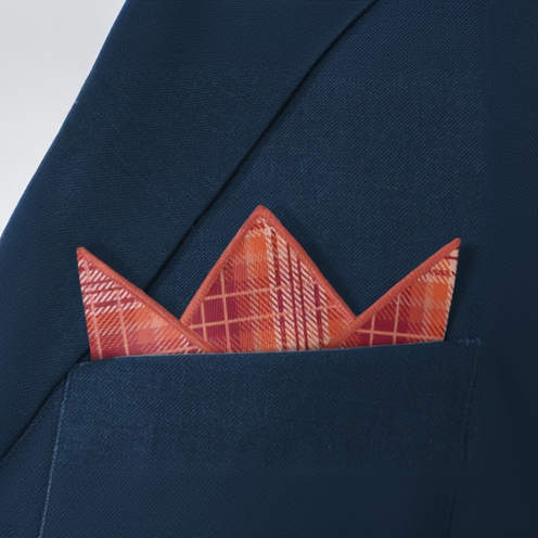 Navy blue blazer with a plaid orange pocket square