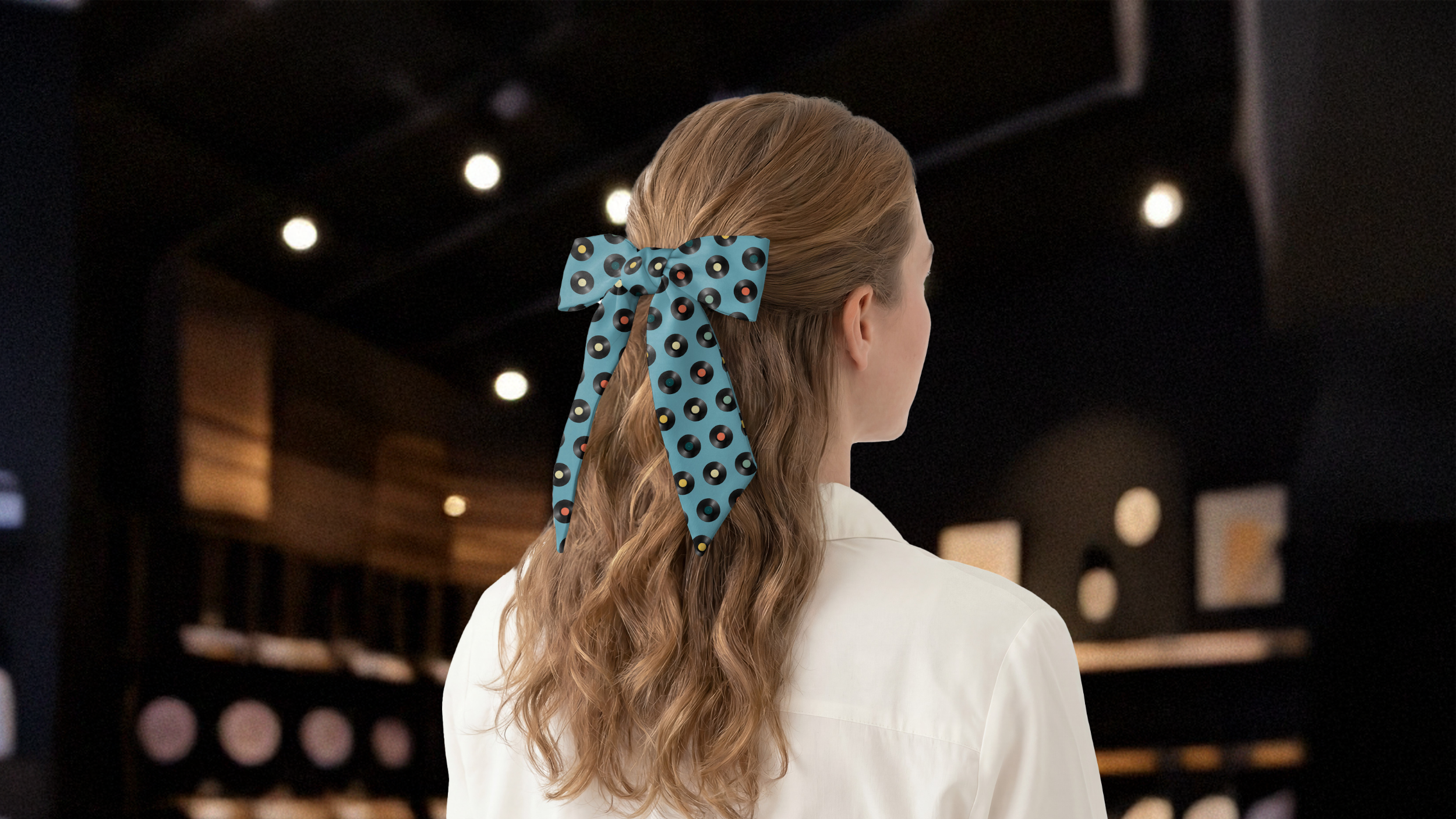 Person with a blue hair scarf in a store setting