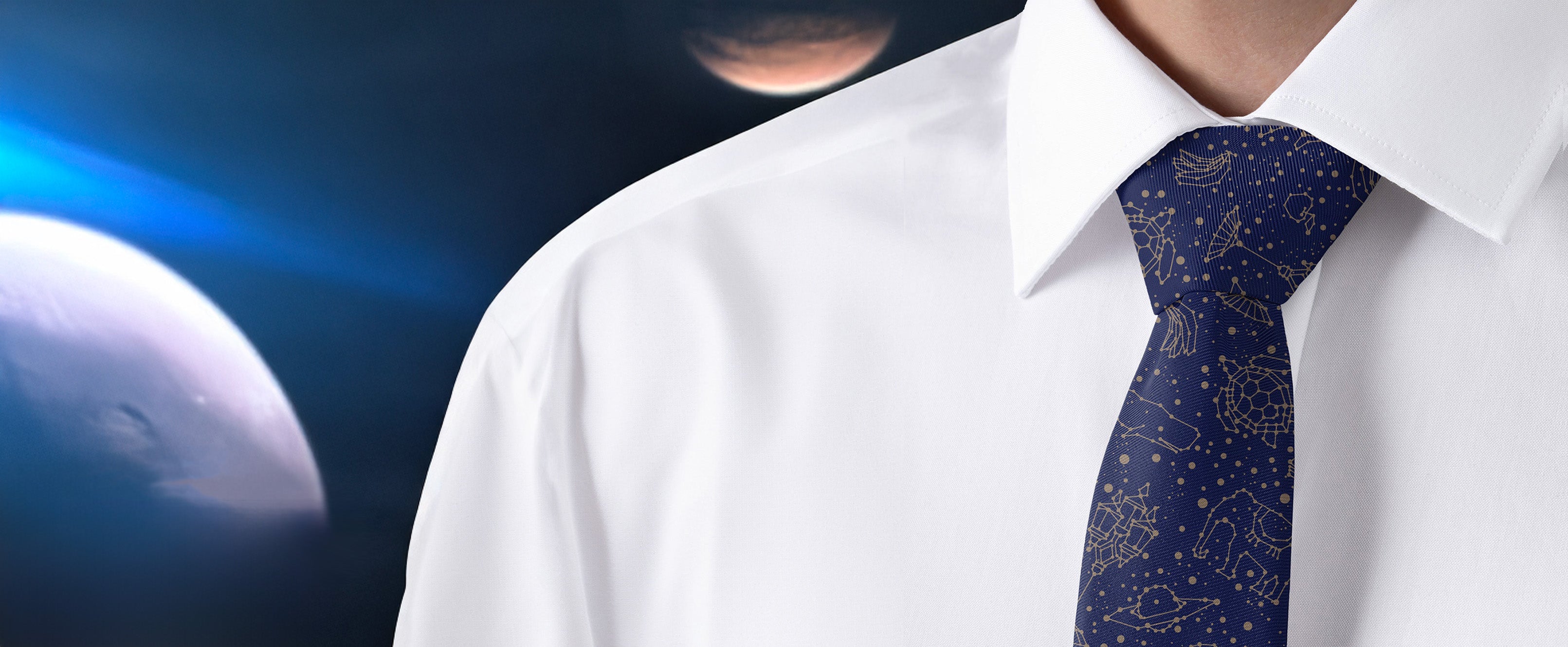 Person wearing a white shirt and a blue tie with star patterns against a space-themed background.