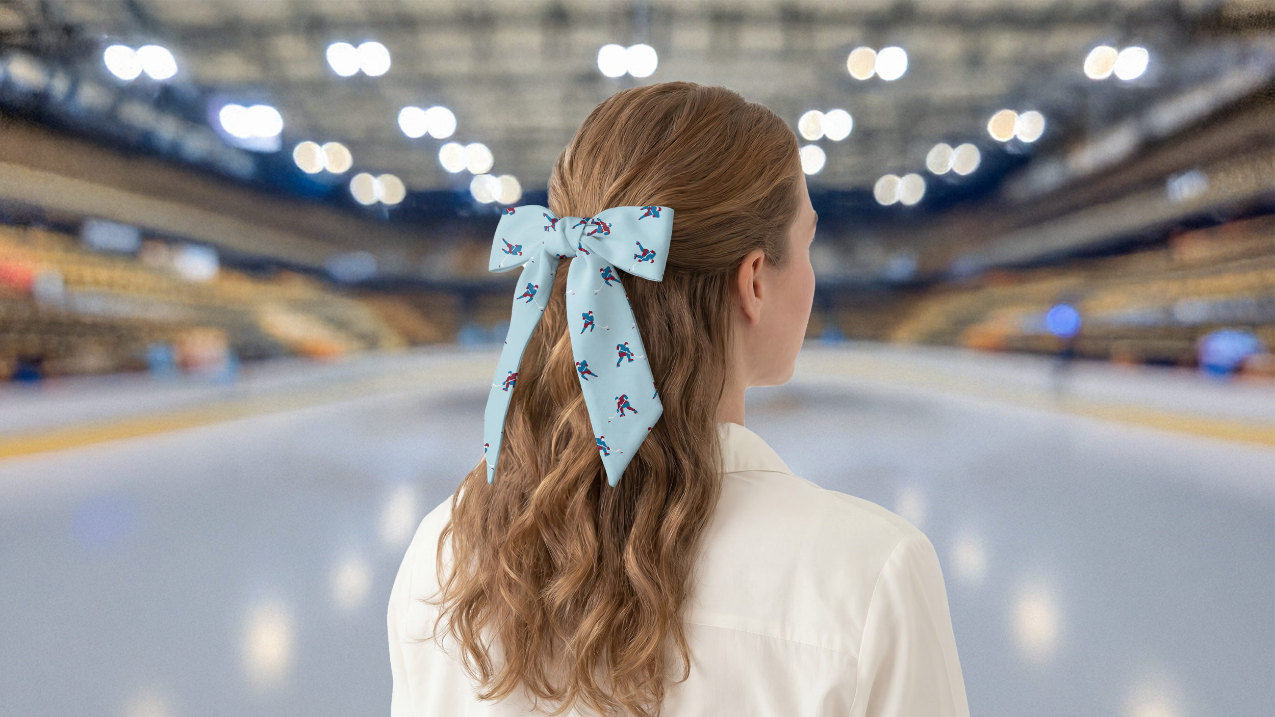 Person with a blue hair scarf featuring hockey players in an indoor ice rink.