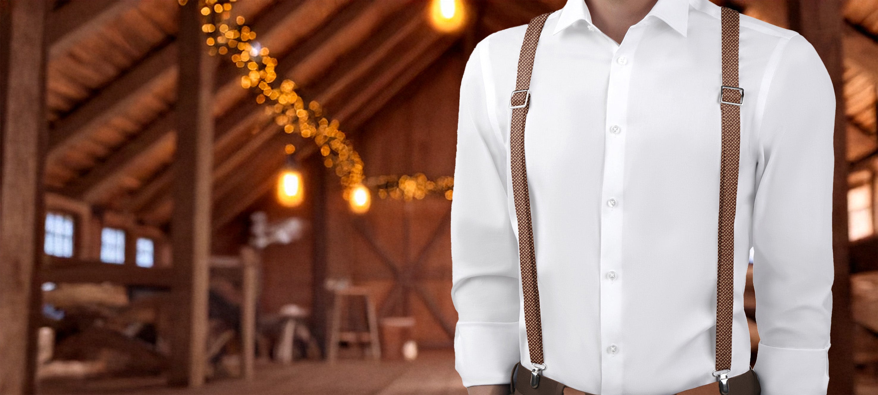 Person wearing a white shirt and brown textured suspenders against a blurred background with lights.
